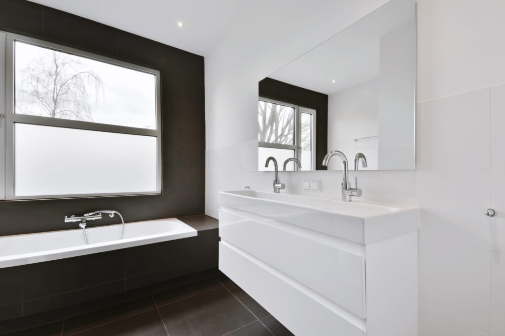 Minimalist bathroom with window and bathtub