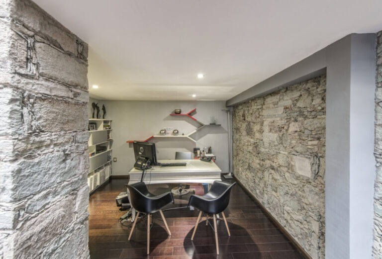 Guanajuato, Guanajuato, Mexico,Mexico,Desk, chairs and stone walls in modern office