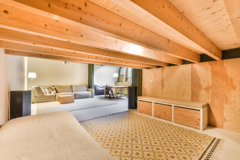a bedroom with a bed and a couch in a