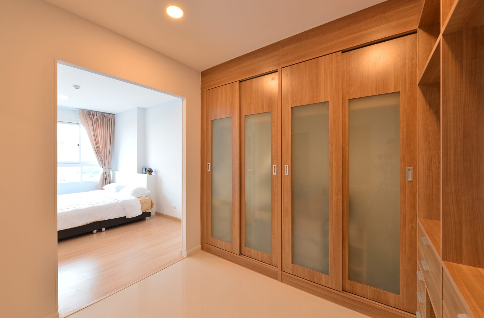 wooden carbinets in dressing room in modern home, interior design