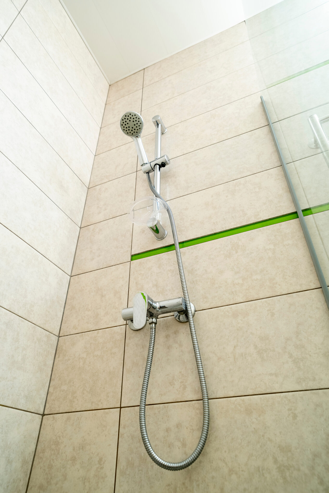 wall-mounted-faucet-with-a-flexible-shower-hose-condo